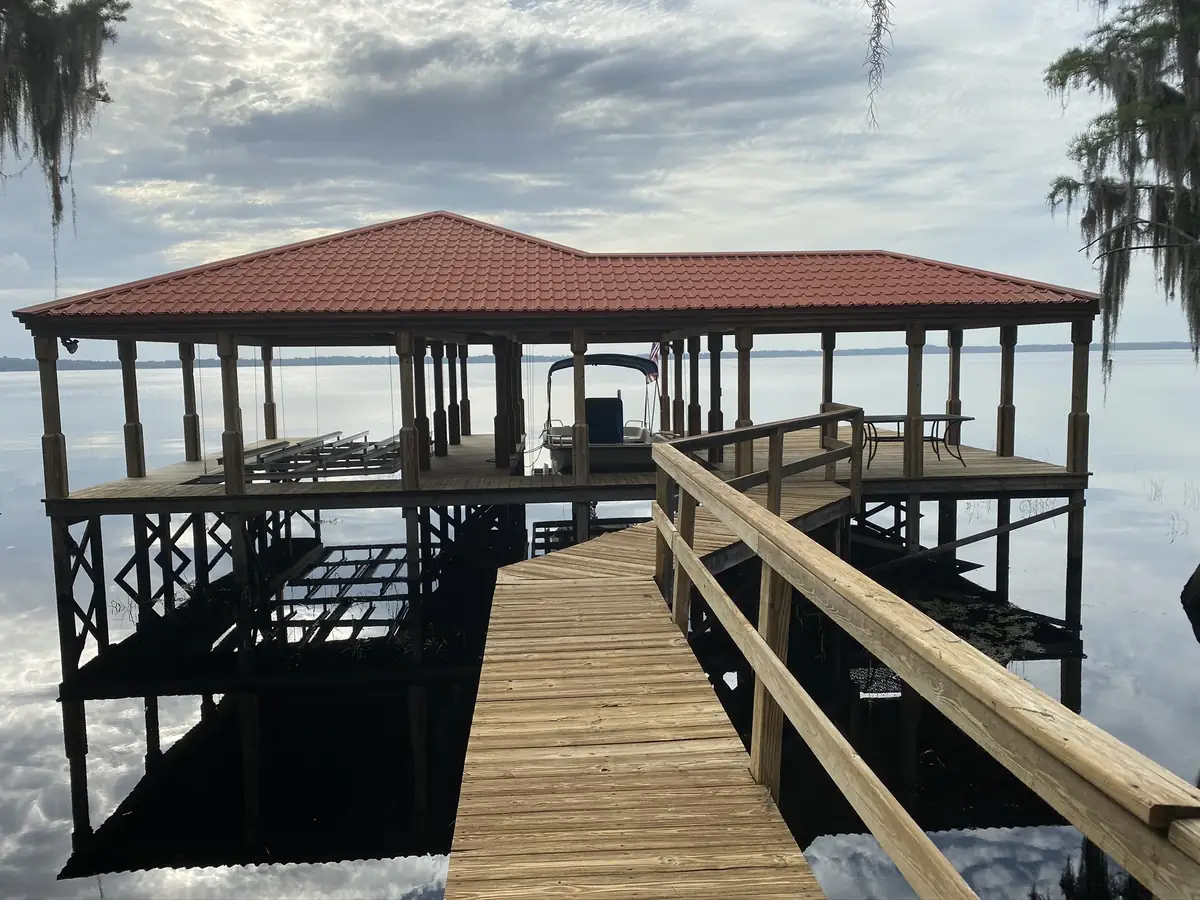 Rebuilt dock with a covered platform over open water