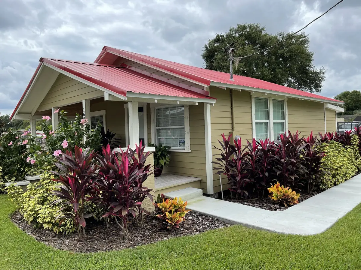 Older home after an exterior remodel with a new standing-seam metal roof