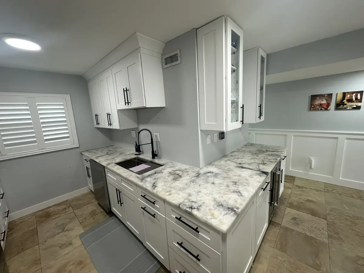 Remodelled kitchen with a marble-topped island